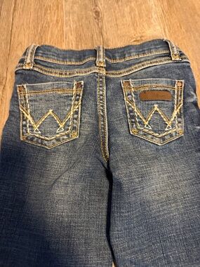 Classic Dark Blue Girl’s Wrangler Jeans with Back Pocket Stitching